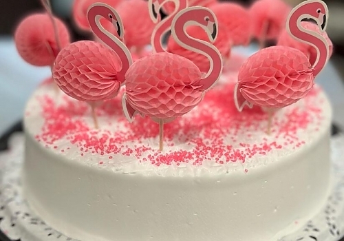 A cake with a bunch of frosting on it showcasing cake delivery.